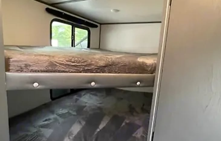 The bunk beds sturdy construction and thoughtful amenities ensure a peaceful and enjoyable stay in your home on wheels.
