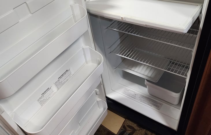 Inside fridge with enclosed freezer up top