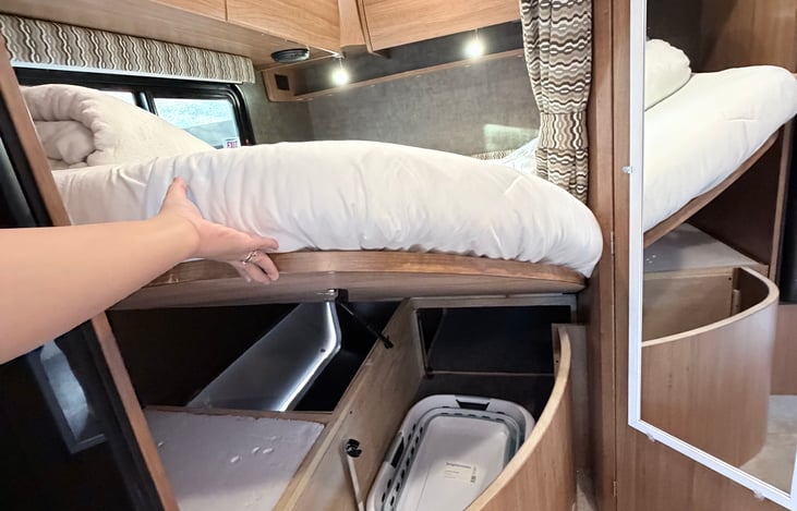 Extra storage space under the bed and a collapsible laundry blanket