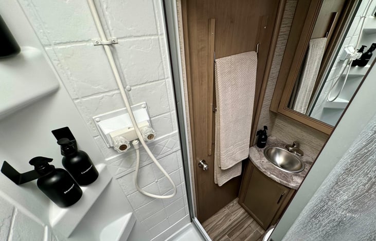 Luxury Bathroom, Anytime, Anywhere
No more public restrooms! Enjoy the privacy and comfort of your modern bathroom, complete with a shower, toilet, and sink. Start your mornings refreshed and ready.