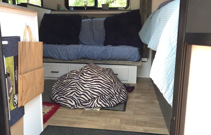 Under the couch & table drawer storage, all weather bean bag for inside or outside use.