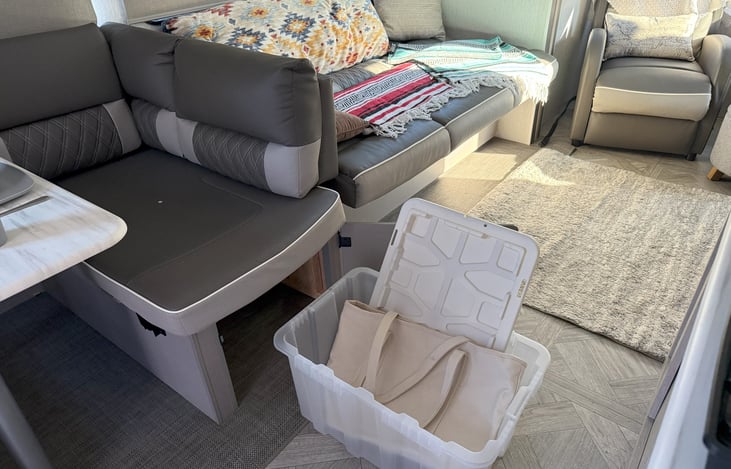 Storage bin under the dining room bench.