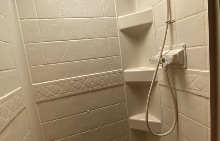 Interior features shelving and a detachable wand