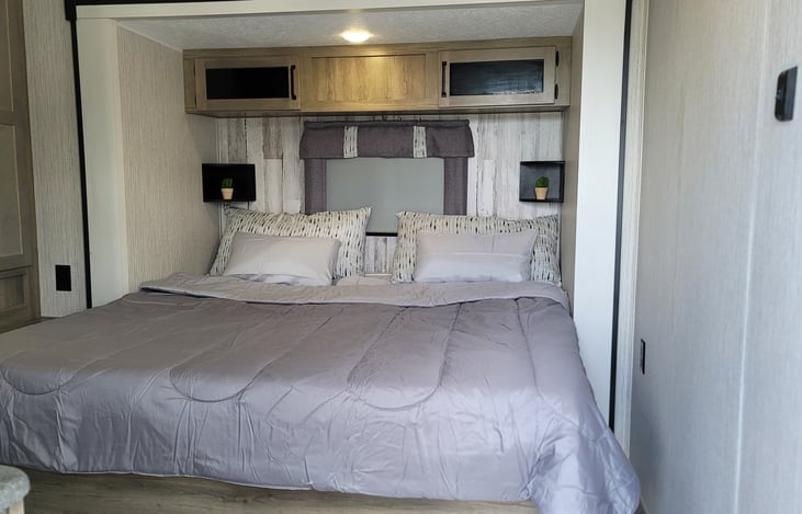 Spacious sleeping area with king size bed and tons of storage space.