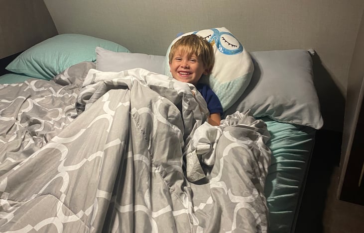 Full size bed with memory foam topped mattress. 
I get my best sleep in the camper. 
Comfy, dark and the a/c fan drowns out any noises.