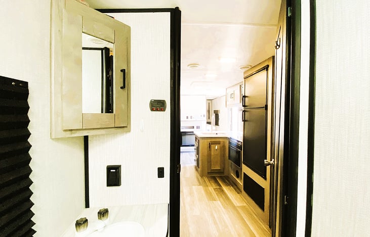 Clean, modern bathroom with plenty of space — comfort for roadtrippers going to Mojave National Preserve, Sequoia Forest, or Red Mountain near Highway 395. RV rentals in Orange County