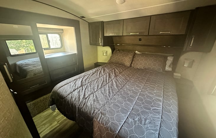 Primary bedroom with access to bathroom.