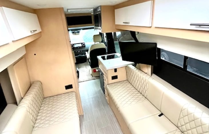 You'll appreciate the hand-stitched leather and solid maple wood residential grade cabinetry that sets this van apart from ordinary vans.  Your smart TV is also connected to an amplified OTA antenna.