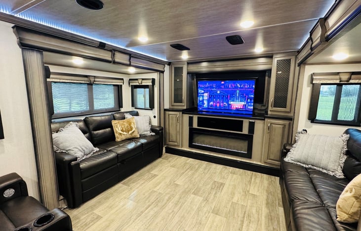 Front living/Entertainment room. This room is the ENTIRE reason that we bought this camper! This area is the best for watching a football game or playing board games with the kids on a rainy day.