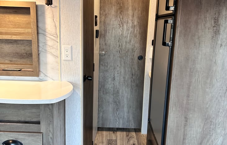 Hallway to private bedroom (see sliding door)