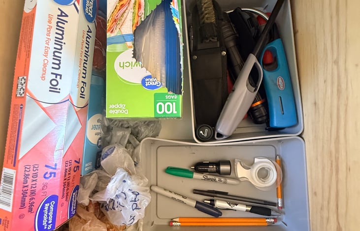 Stocked with the essentials—foil, zip bags, and lighters for easy meals and campfire prep 🔥🍳