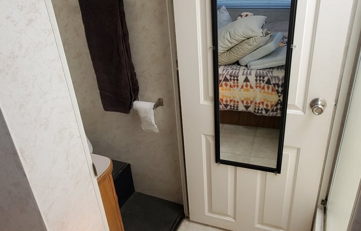 Bathroom door opens to give more space and privacy after a shower
