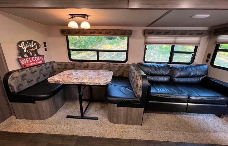 Dinette sleeper and Tri-Fold Sofa Sleeper in the living area. Great windows to see the action outside!