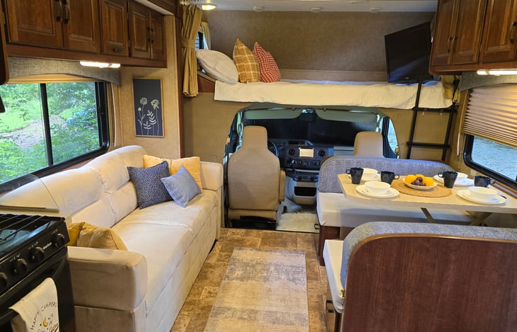 Convertible couches & dinette for sleeping.