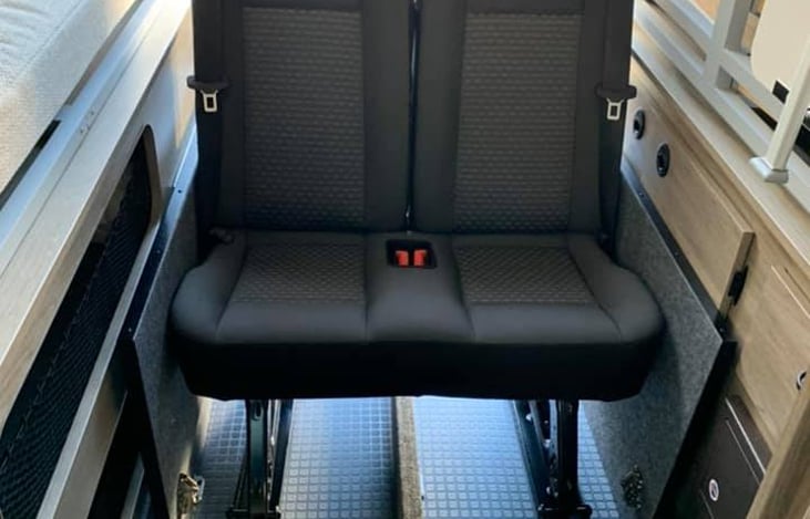 Those are optional extra two chairs that can be added to drive 6 people with seatbelts!