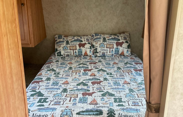 Master bed with closets on both sides & storage above!