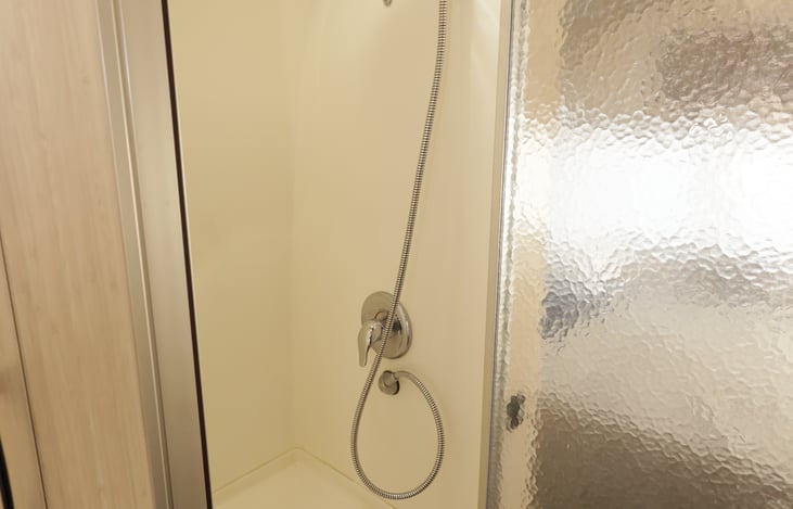 Large shower with seat.