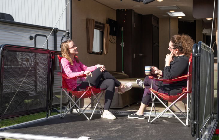 Relaxation and conversation with friends on your open camper/deck