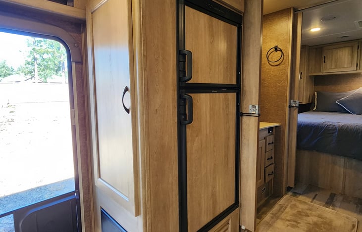 Refrigirator with freezer, storage on top & on the side.