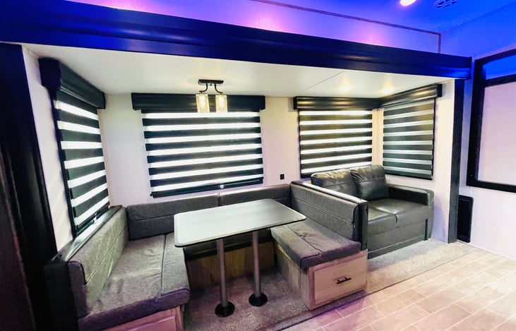 6’4” Slide Room Height (Main Level Floor Slides) with Oversized Panoramic Windows. Zebra Shades” (Light Filtering with Blackout Capability) In Main Living Area. Dual Port USB Charging Stations