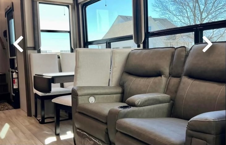 Dining space and couches that recline and have heated seats and vibration.