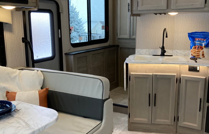 Kitchen/Dining area and pantry in hallway.