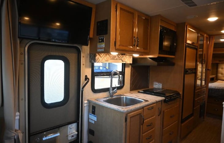 Custom full-size kitchen sink makes clean-up a breeze.