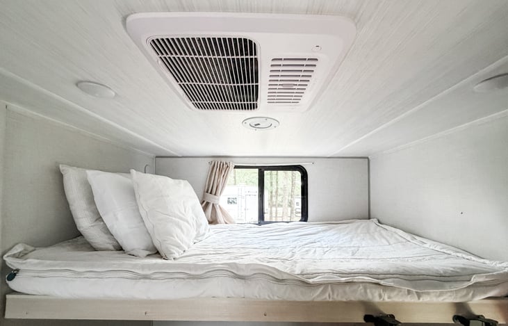 Loft overhead third bunk in bunk room.
