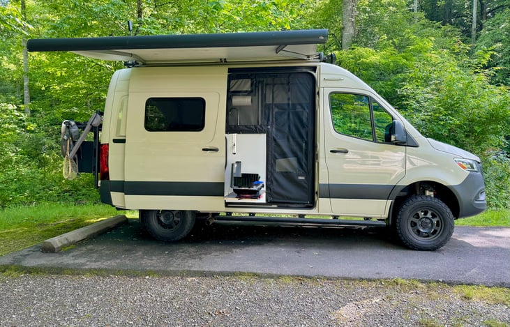 Passenger side, awning and door open.