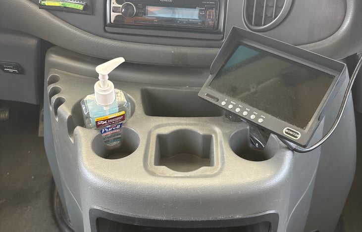 Center console with Kenwood stereo, ports for old Apple phones, new Apple phones, and androids. Back up camera with passenger and driver side view.