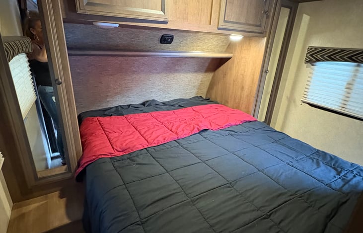 Queen bed with under storage and closet space