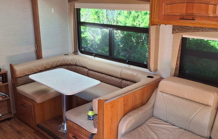 cozy settee and love seat fold down to make sleeping areas. ample rood above cab for two more guest.