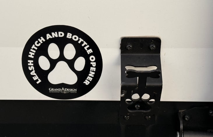 Leash hitch and bottle opener