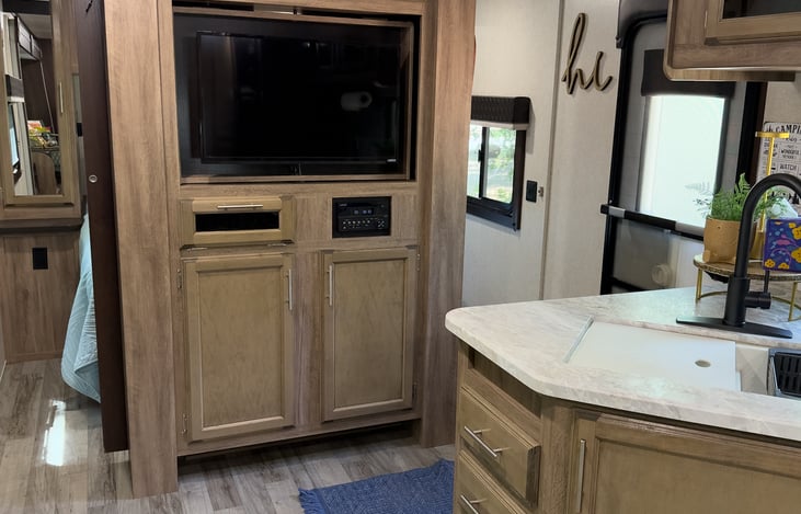 Under the TV is where we store games, lanterns, DVDs all included with your stay!