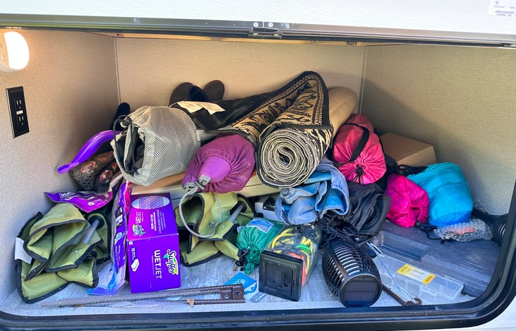 Tons of chairs, a folding plastic table(NOT picnic style with benches), solar lights, an outdoor mat and hammocks.
