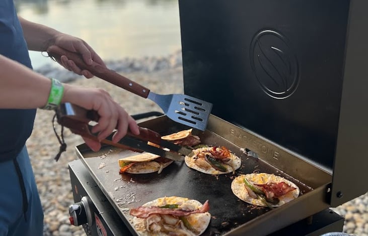 Outdoor cooking package includes 22" blackstone grill, cooking utensils and a full smore setup with firewood for an additional fee.