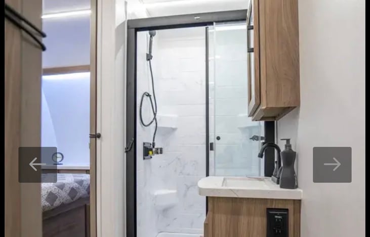 Full bathroom. Shower, toilet, sink. Accessible from bedroom or hallway.