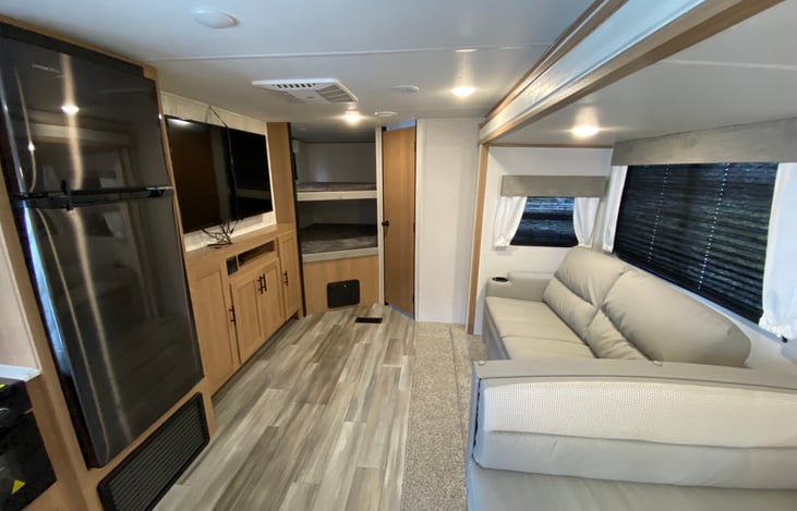 COUCH(CONVERTS TO BED) WITH 40" TV SETUP WITH ROKU