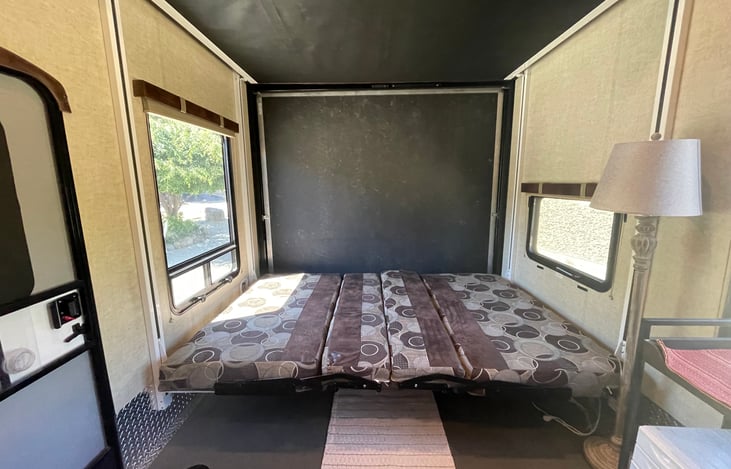 Garage; Lower bed set up. Upper bunk raised.