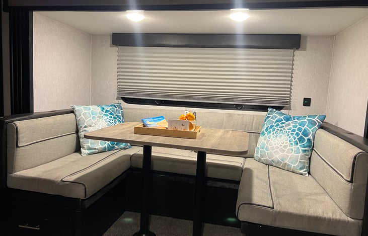 Dining area w/large window and shades extended