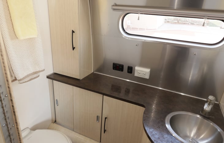 Large bathroom toilet and sink.