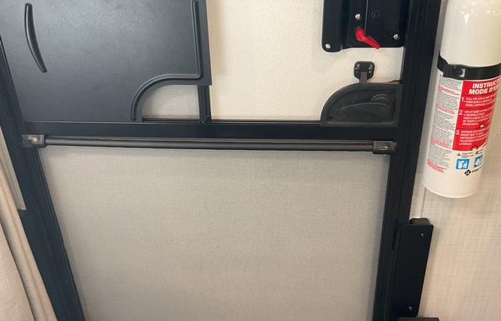 Strong, medal door lock with deadbolt. Fire extinguisher.