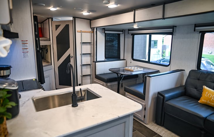 Step into comfort and convenience in our 2022 Heartland Mallard 26! Your adventure begins in this spacious and modern main living area, perfect for relaxing after a day of outdoor fun