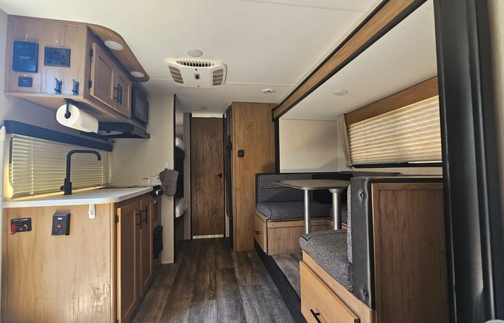 Inside of our cozy camper. We love it and take great care of it and look forward to hosting you.