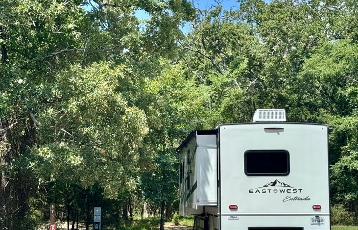 View of the camper when parked at a campsite
