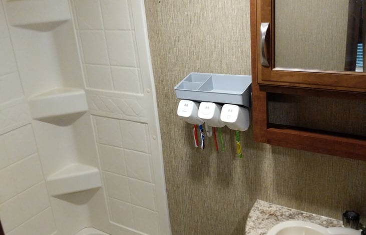 Bathroom with Tooth Brush Holder and water cups.