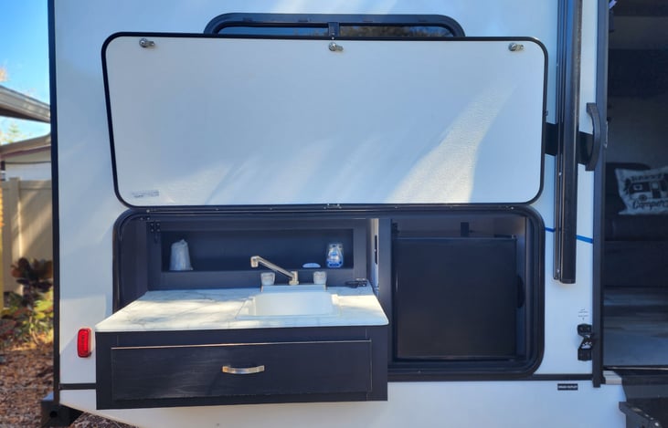 Our door sink and fridge for and easy quick access