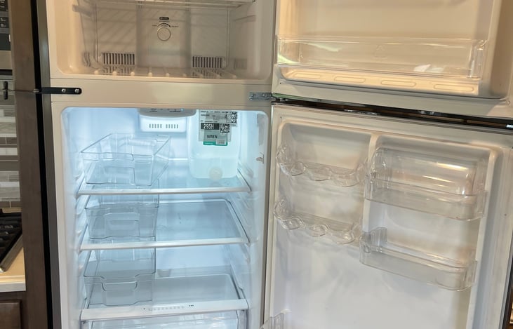 Full size refrigerator and freezer above