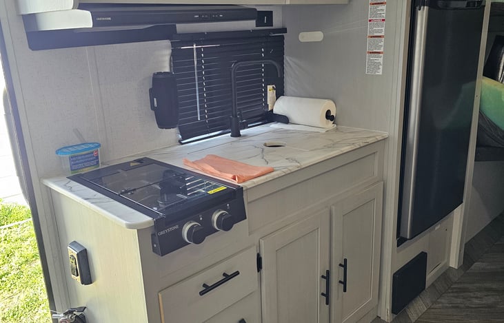 Full kitchen with a microwave