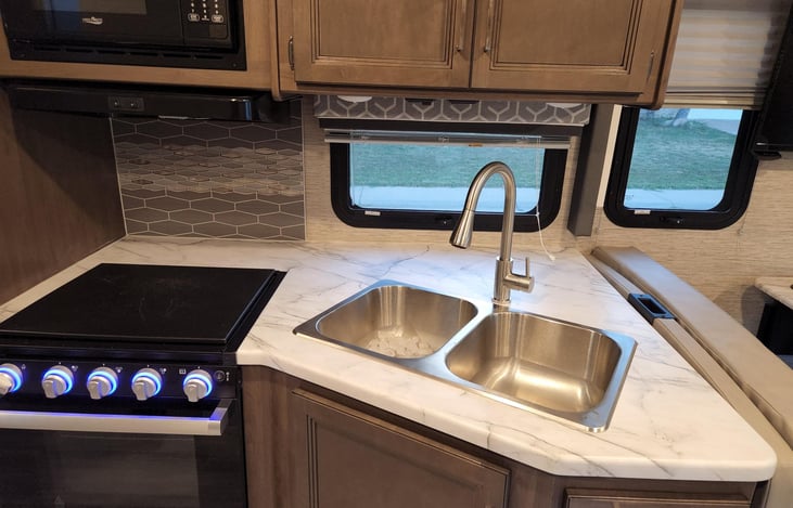 Kitchenette with Gas Stove and Illuminating Dials